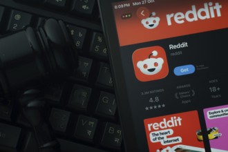 Dhaka, Bangladesh- 28 Oct 2025: An iPad displaying the Reddit app against a judge's gavel and dark