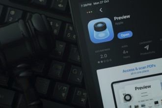 Dhaka, Bangladesh- 28 Oct 2025: An iPad displaying the Apple Preview app against a judge's gavel