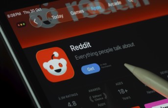 Dhaka, Bangladesh- 30 Oct 2025: Reddit app displayed on a iPad screen in dark mode with a digital