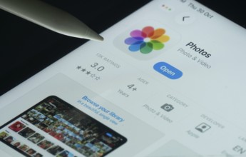 Dhaka, Bangladesh- 30 Oct 2025: Apple Photos app on a iPad screen with a pen pointing at the