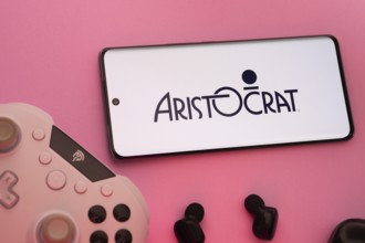 Dhaka, Bangladesh- 08 Apr 2025: A smartphone displaying the Aristocrat logo next to a gaming