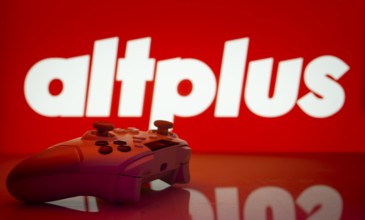 Dhaka, Bangladesh- 20 Mar 2025: A close-up of a white gamepad with the AltPlus Inc seen on screen