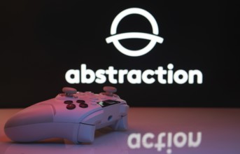 Dhaka, Bangladesh- 20 Mar 2025: A close-up of a white gamepad with the Abstraction seen on screen