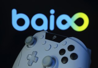 Dhaka, Bangladesh- 20 Mar 2025: A close-up of a gamepad with the Baioo Family Interactive Ltd seen