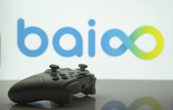 Dhaka, Bangladesh- 20 Mar 2025: A close-up of a white gamepad with the Baioo Family Interactive Ltd