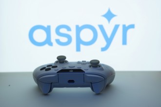 Dhaka, Bangladesh- 08 Apr 2025: A gaming controller in front of a Aspyr screen