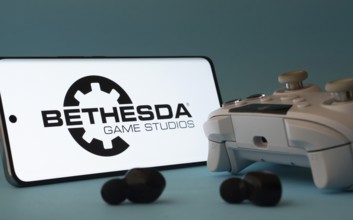 Dhaka, Bangladesh- 23 Mar 2025: A smartphone with a Bethesda Game Studios icon next to a controller