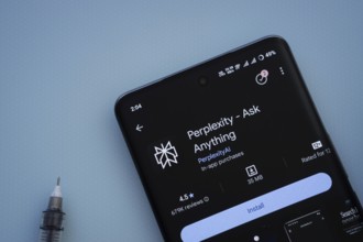 Dhaka, Bangladesh- 29 May 2025: On a blue surface, a smartphone displays the Perplexity app within