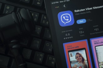 Dhaka, Bangladesh- 28 Oct 2025: An iPad displaying the Rakuten Viber app against a judge's gavel