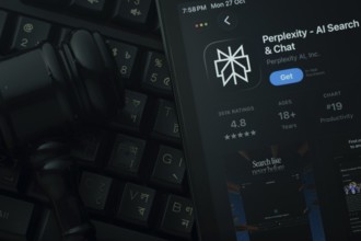 Dhaka, Bangladesh- 28 Oct 2025: An iPad displaying the Perplexity app against a judge's gavel and