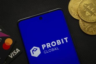Dhaka, Bangladesh- 26 Aug 2025: Smartphone displaying ProBit Global logo surrounded by Bitcoin