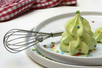 Meringue in the shape of a Christmas tree and whisk, Christmas cookies, meringue