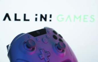 Dhaka, Bangladesh- 20 Mar 2025: A close-up of a gamepad with the All in! Games seen on screen in