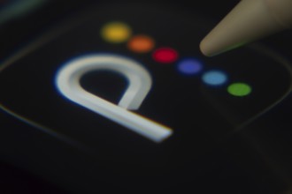 Dhaka, Bangladesh- 06 Dec 2025: Close-up of the Peacock TV app on a screen with a stylus pointing