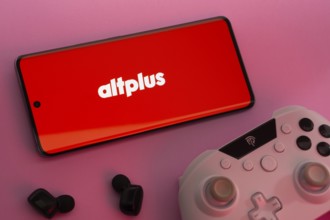 Dhaka, Bangladesh- 08 Apr 2025: A smartphone displaying the AltPlus Inc logo next to a gaming