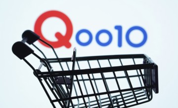 Dhaka, Bangladesh- 03 July 2025: Silhouette of a shopping cart in front of the Qoo10 logo,