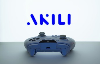 Dhaka, Bangladesh- 08 Apr 2025: A gaming controller in front of a Akili Interactive screen