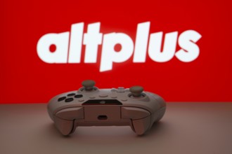 Dhaka, Bangladesh- 08 Apr 2025: A gaming controller in front of a AltPlus Inc screen