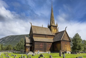 Lom Stave Church (Lom stavkyrkje) with cemetery in the foreground, Lom, Norway