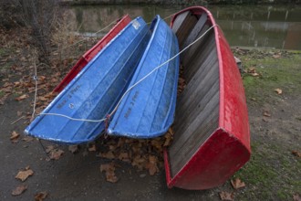 Assembled rowing boats on the banks of Pegnitz, river in Nuremberg, Middle Franconia, Bavaria,