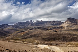 Rocky mountain landscape with thick cloud cover in the sky, The highlands of the Andes of Peru