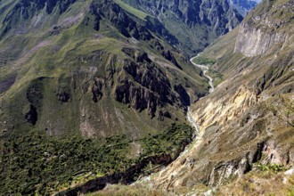 Impressive gorge in a far-reaching mountain landscape under blue skies, The landscape of Colca