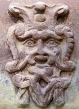 Old stone mask, face on a wall, Welf Castle of Herzberg, Herzberg am Harz, district of Göttingen,