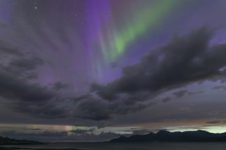 The Vestfjord in Nordland, Norway, has an enchanting atmosphere at night. Dark clouds and vivid