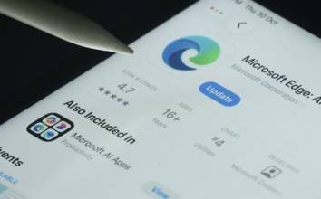 Dhaka, Bangladesh- 30 Oct 2025: Microsoft Edge app on a iPad screen with a pen pointing at the