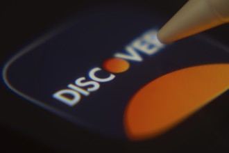 Dhaka, Bangladesh- 06 Dec 2025: Close-up of the Discover app on a screen with a stylus pointing at