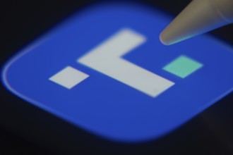 Dhaka, Bangladesh- 06 Dec 2025: Close-up of the Truth Social app on a screen with a stylus pointing