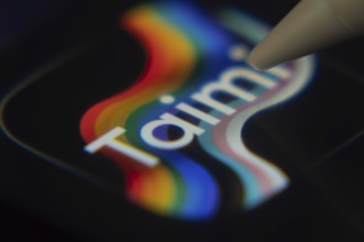 Dhaka, Bangladesh- 06 Dec 2025: Close-up of the Taimi app on a screen with a stylus pointing at it