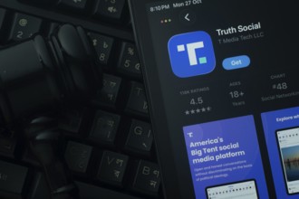 Dhaka, Bangladesh- 28 Oct 2025: An iPad displaying the Truth Social app against a judge's gavel and