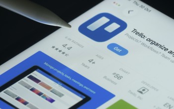 Dhaka, Bangladesh- 30 Oct 2025: Trello app on a iPad screen with a pen pointing at the install