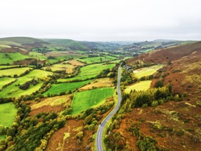 Autumn colours of Farms over River Wye and Road A470 from a drone, Llanidloes, Powys,
