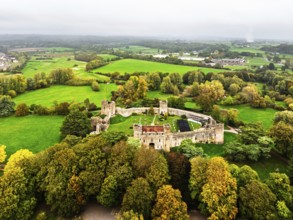 Autumn Colours over ruins of Caldicot Castle from a drone, Caldicot, Monmouthshire, Wales, UK