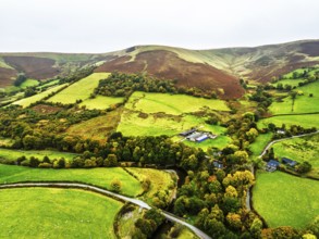 Autumn colours of Farms over River Wye and Road A470 from a drone, Llanidloes, Powys,