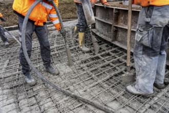 Concreting, concreting the foundation of a wind turbine, concrete pump hose, compressor, more than
