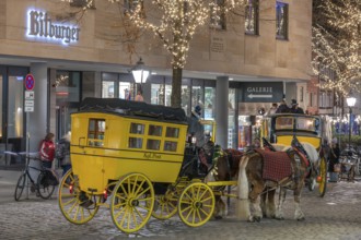 Historic stagecoach rides with horseback during the Nuremberg Christmas Market, Nuremberg, Middle
