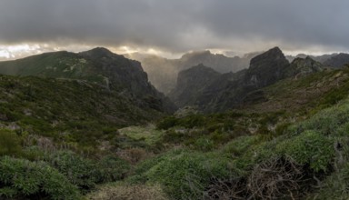 Sunset at Pico do Arieiro, sun shining through clouds, sunbeam, hiking trail PR1, Madeira, Portugal