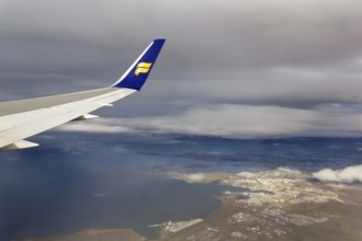 Wing, airplane, Icelandair airline logo, flying to Boston, view of Reykjavik, aerial view, Iceland
