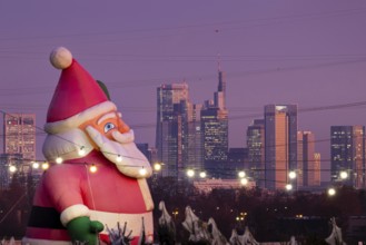 In a Christmas tree center near Frankfurt am Main, a multi-metre-high inflated figure of Santa