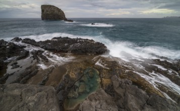 Rocky coast, volcanic rock formations, coast near Porto da Cruz, Madeira, Portugal
