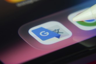 16 Nov 2025- Dhaka, Bangladesh: Stylus touching the Google Translate app icon on a smartphone