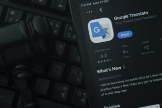 Dhaka, Bangladesh- 28 Oct 2025: An iPad displaying the Google Translate app against a judge's gavel