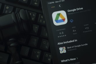 Dhaka, Bangladesh- 28 Oct 2025: An iPad displaying the Google Drive app against a judge's gavel and