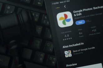 Dhaka, Bangladesh- 28 Oct 2025: An iPad displaying the Google Photos app against a judge's gavel