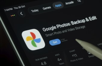 Dhaka, Bangladesh- 30 Oct 2025: Google Photos app displayed on a iPad screen in dark mode with a