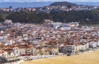 View from Leuct Tower towards orange tiled roofs in the town of Nazare, Estremadura, Portugal