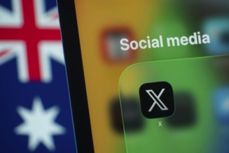 Dhaka, Bangladesh- 01 Dec 2025: A smartphone screen displays the X app with an Australian flag in